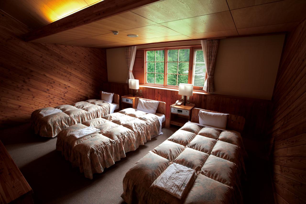 Log Hotel Larch Lake Kanayama Minamifurano Habitación foto